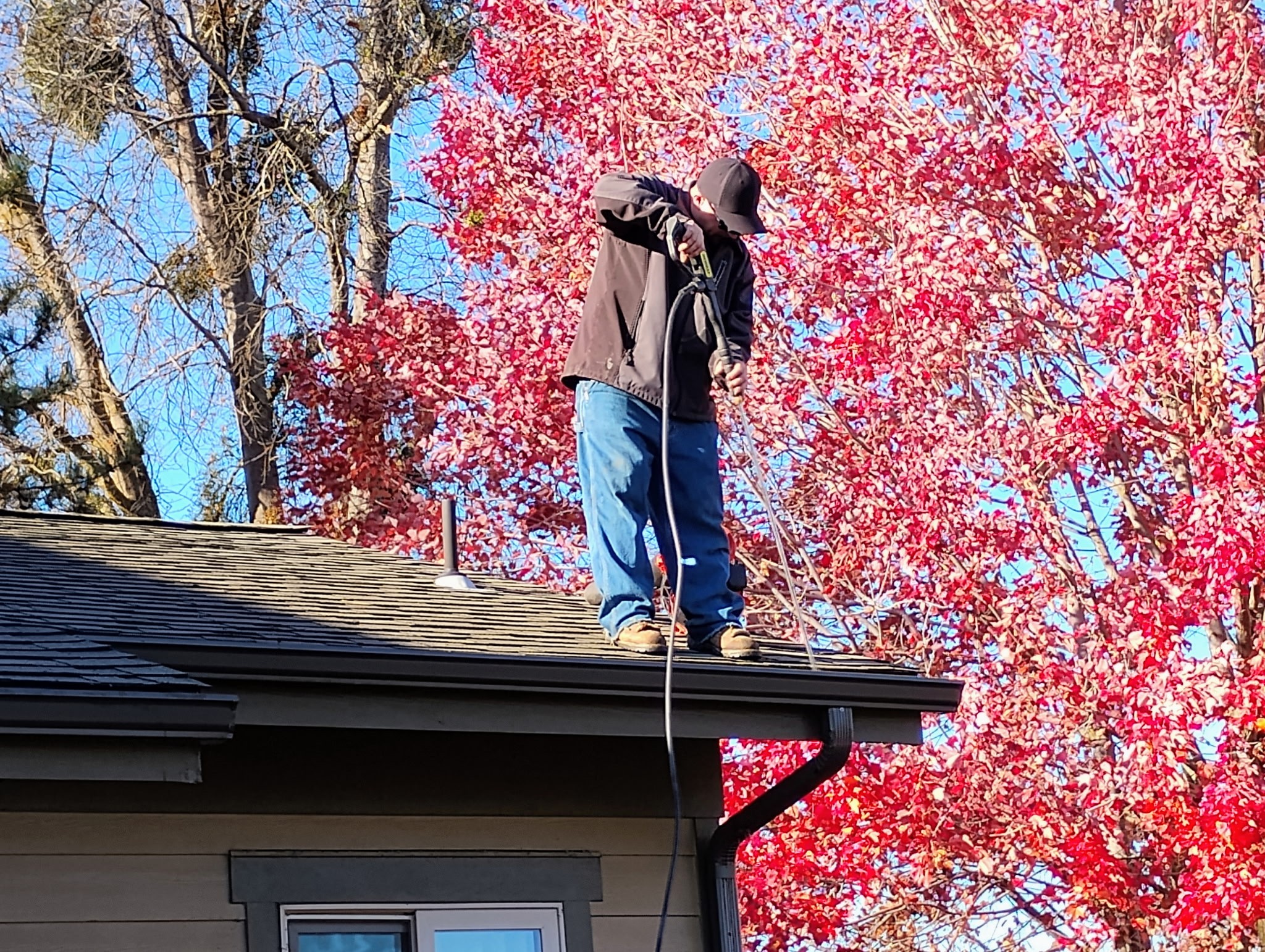 Roof work being completed by a technician